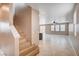 Living room with view of stairway and open access to kitchen and backyard at 9217 Valley Betica Ave, Las Vegas, NV 89148