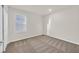 A cozy bedroom featuring neutral carpeting and a window with bright light at 9327 Ettrick Ct, Las Vegas, NV 89178