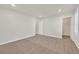 This carpeted bedroom has neutral color walls with natural light from windows at 9327 Ettrick Ct, Las Vegas, NV 89178