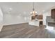Spacious living space featuring modern lighting and an open flow into a gourmet kitchen at 9327 Ettrick Ct, Las Vegas, NV 89178