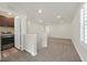 A spacious upstairs loft space featuring plush carpet with an adjacent laundry area at 9327 Ettrick Ct, Las Vegas, NV 89178