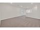 Upstairs loft features neutral carpet and bright natural light from the nearby window at 9327 Ettrick Ct, Las Vegas, NV 89178
