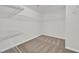 A functional walk-in closet with ample shelving, rod storage, and neutral carpet flooring at 9327 Ettrick Ct, Las Vegas, NV 89178