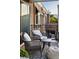 Cozy balcony with comfortable seating, overlooking lush greenery and mountains at 9430 Laguna Niguel Dr # 203, Las Vegas, NV 89134