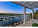 Enjoy water views from this beautiful balcony with a pergola and railing at 9430 Laguna Niguel Dr # 203, Las Vegas, NV 89134