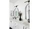 Elegant bathroom featuring double vanities, marble countertops, and modern black fixtures at 9430 Laguna Niguel Dr # 203, Las Vegas, NV 89134