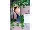 Inviting townhouse features a stairway to the entrance, a garage and a well-maintained landscaped yard at 9430 Laguna Niguel Dr # 203, Las Vegas, NV 89134