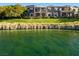 Exterior of a condo with a beautiful view of the water and green grass at 9430 Laguna Niguel Dr # 203, Las Vegas, NV 89134
