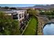 Exterior of a multi-story home overlooking a river and green space at 9430 Laguna Niguel Dr # 203, Las Vegas, NV 89134