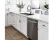 Bright kitchen with stainless steel appliances, white cabinets, countertops, and a tile floor at 9430 Laguna Niguel Dr # 203, Las Vegas, NV 89134