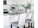 Kitchen with stainless steel sink, modern faucet, and sleek bar stools, ideal for casual dining at 9430 Laguna Niguel Dr # 203, Las Vegas, NV 89134