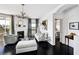 Bright living room featuring a fireplace, dark wood floors, and neutral decor at 9430 Laguna Niguel Dr # 203, Las Vegas, NV 89134