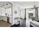 View of living room, dining area and kitchen with open-concept floor plan at 9430 Laguna Niguel Dr # 203, Las Vegas, NV 89134