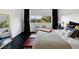 Bright main bedroom with a view, featuring a cozy seating area and modern decor at 9430 Laguna Niguel Dr # 203, Las Vegas, NV 89134