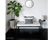 Cozy sitting area showcasing a fiddle leaf fig tree and a modern black and white bench at 9430 Laguna Niguel Dr # 203, Las Vegas, NV 89134