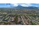 Sweeping aerial shot of this desirable neighborhood, highlighting lush fairways, mature trees, and scenic mountain views at 9513 Yucca Blossom Dr, Las Vegas, NV 89134
