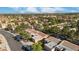 Expansive aerial view of a residential neighborhood with desert landscaping, showcasing a vibrant community and stunning desert backdrop at 9513 Yucca Blossom Dr, Las Vegas, NV 89134