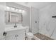 Updated bathroom with modern vanity, sleek mirror, and a glass enclosed shower with unique tile at 9513 Yucca Blossom Dr, Las Vegas, NV 89134