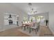 Bright dining room featuring neutral walls, modern furniture, and an adjacent kitchen with stainless steel appliances at 9513 Yucca Blossom Dr, Las Vegas, NV 89134