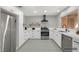 Updated kitchen featuring stainless steel appliances and white cabinets, plus an ornate tile floor at 9513 Yucca Blossom Dr, Las Vegas, NV 89134
