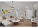 Bright living room features a stylish white sofa set and modern artwork at 9513 Yucca Blossom Dr, Las Vegas, NV 89134