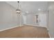 Spacious living room with light hardwood floors and a contemporary light fixture at 9513 Yucca Blossom Dr, Las Vegas, NV 89134