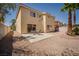 Private backyard with a patio, desert landscaping, and mature trees, creating a relaxing outdoor space at 9604 Summer Cypress St, Las Vegas, NV 89123