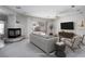 Bright living room offers a modern fireplace, neutral tones, and backyard access for indoor-outdoor living at 9604 Summer Cypress St, Las Vegas, NV 89123