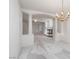 Bright living room features a modern fireplace and arched doorway with pillars for an elegant design at 9604 Summer Cypress St, Las Vegas, NV 89123