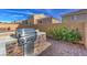 Backyard with brick patio, built-in stainless steel grill, and bar at 9876 Parador Cellars Ct, Las Vegas, NV 89141