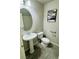 Neutral half bath with a pedestal sink and dark tile flooring at 9876 Parador Cellars Ct, Las Vegas, NV 89141