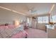 Cozy bedroom featuring a bed, desk, dresser, and natural light at 9876 Parador Cellars Ct, Las Vegas, NV 89141