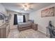 Bedroom featuring a bed, desk, dresser, television, and ceiling fan at 9876 Parador Cellars Ct, Las Vegas, NV 89141