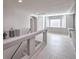 Bright second floor hallway with a view to a window at 9876 Parador Cellars Ct, Las Vegas, NV 89141