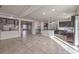 Bright, open kitchen features a large island, stainless steel appliances, and tile floors at 9876 Parador Cellars Ct, Las Vegas, NV 89141