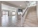 Spacious living area with tile floors, recessed lighting, and sliding glass doors to the patio at 9876 Parador Cellars Ct, Las Vegas, NV 89141