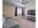 Living room with a couch, large television, and carpet at 9876 Parador Cellars Ct, Las Vegas, NV 89141