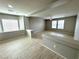Upstairs living area with neutral paint, natural light, and tiled floors at 9876 Parador Cellars Ct, Las Vegas, NV 89141