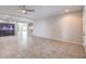 Bright living room with tile floors, recessed lighting, ceiling fans, and an aquarium at 9876 Parador Cellars Ct, Las Vegas, NV 89141