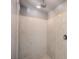Walk-in shower with rainfall shower head and marble surround at 9876 Parador Cellars Ct, Las Vegas, NV 89141