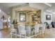 Stylish bar area with stone countertops, comfortable seating, mirrored backsplash, and convenient access to living spaces at 9905 Fox Springs Dr, Las Vegas, NV 89117