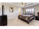 Cozy bedroom featuring carpet, neutral walls, and a ceiling fan for added comfort at 9905 Fox Springs Dr, Las Vegas, NV 89117