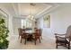 Elegant dining room with chandelier and seating for six at 9905 Fox Springs Dr, Las Vegas, NV 89117