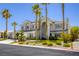 A home featuring palm trees, well-kept landscaping, and a welcoming front entryway for a warm curb appeal at 9905 Fox Springs Dr, Las Vegas, NV 89117