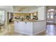 Open-concept kitchen with large island and high-end appliances at 9905 Fox Springs Dr, Las Vegas, NV 89117