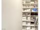 Well-organized linen closet with ample shelving for towels, toiletries, and household items at 9905 Fox Springs Dr, Las Vegas, NV 89117