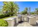 Built-in outdoor kitchen with stainless steel appliances and ample counter space, perfect for outdoor cooking and entertaining at 9905 Fox Springs Dr, Las Vegas, NV 89117
