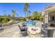 Backyard featuring a pool, spa, fire pit, and lounge area, creating an inviting space for relaxation and entertainment at 9905 Fox Springs Dr, Las Vegas, NV 89117