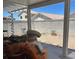 Spacious backyard with a covered patio, surrounded by block walls, offering privacy and outdoor entertaining possibilities at 9940 Trailing Vine St, Las Vegas, NV 89183
