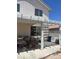 Exterior backyard with an outdoor structure, blue trash container, and other items at 9940 Trailing Vine St, Las Vegas, NV 89183
